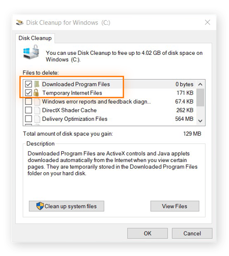 Recurso Limpeza de Disco para Windows aberto. Configure para excluir: Arquivos de Programas Baixados e Arquivos Temporários