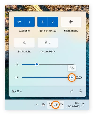 Adjusting audio volume on Windows 11 taskbar.
