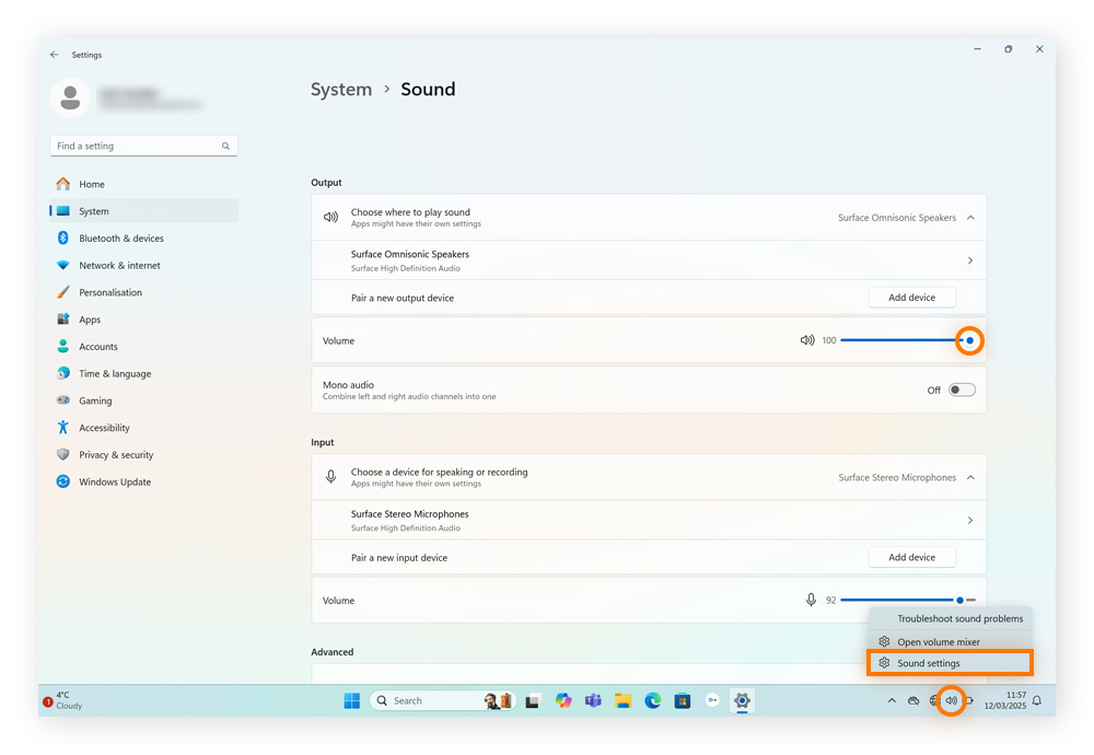 Opening sound settings via the Windows taskbar.