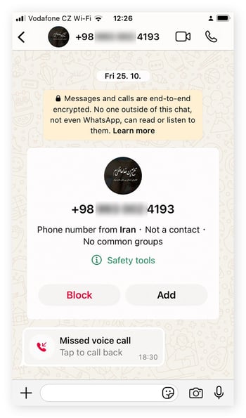 WhatsApp notification about being contacted by an unknown number.