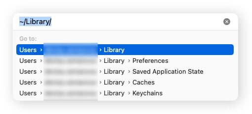 El cuadro de texto Ir a carpeta en macOS Sonoma, que muestra el comando para la carpeta Biblioteca.