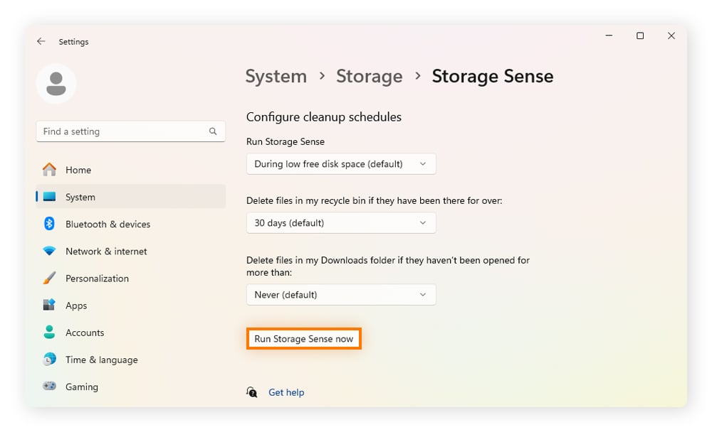 The "Run storage sense now" option within the Storage Sense window.