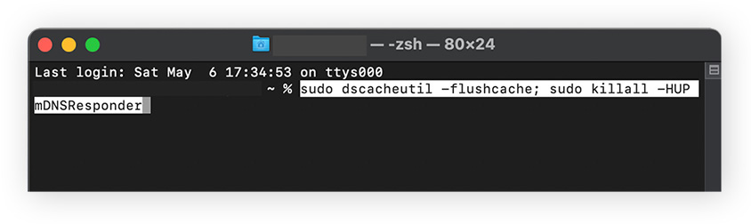 Using Terminal to type a code to clear the DNS cache on macOS.