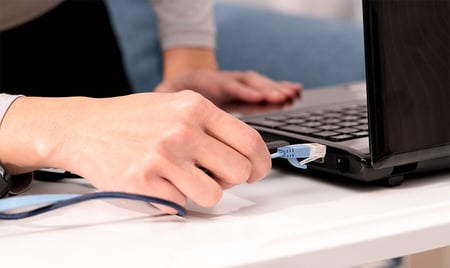 Speed up your internet speed by connecting your computer to your router with an Ethernet cable.